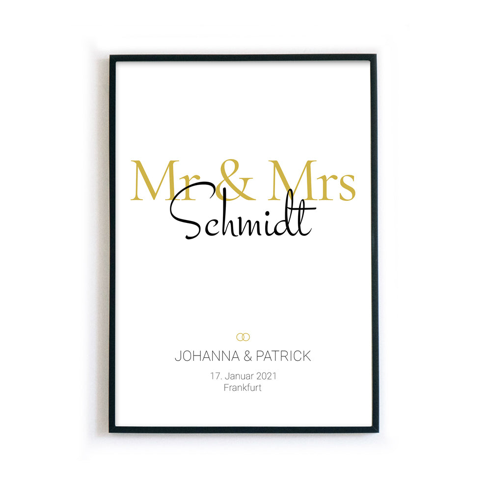Mr & Mrs in Gold. Poster mit Personalisierten Nachnahmen, Vornamen, Ort und Datum. Bild im schwarzen Bilderrahmen.